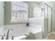 The bathtub is nicely decorated with a gray towel and a small gift box at 106 Terrapin Cir, Summerville, SC 29483