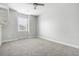 Bright bedroom featuring neutral carpet, a ceiling fan, and a window providing natural light at 106 Terrapin Cir, Summerville, SC 29483