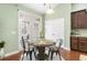 Cozy dining area with modern lighting, hardwood floors, and access to the backyard at 106 Terrapin Cir, Summerville, SC 29483