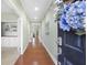 Welcoming entryway with hardwood floors, built in bookshelves, and view towards the living room at 106 Terrapin Cir, Summerville, SC 29483