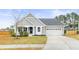 Charming single Gathering home boasting a manicured lawn, two car garage, and craftsman style architecture at 106 Terrapin Cir, Summerville, SC 29483