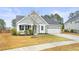 Inviting home with tidy landscaping, a two-car garage, and a classic suburban aesthetic at 106 Terrapin Cir, Summerville, SC 29483