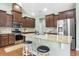 Modern kitchen with stainless steel appliances, granite countertops, and dark wood cabinetry at 106 Terrapin Cir, Summerville, SC 29483