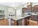 Spacious kitchen with stainless steel appliances, granite countertops, and dark wood cabinetry at 106 Terrapin Cir, Summerville, SC 29483