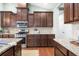 Updated kitchen with stainless steel appliances, granite countertops, and dark wood cabinetry at 106 Terrapin Cir, Summerville, SC 29483