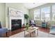 Inviting living room with natural light, fireplace, and comfortable chairs, perfect for Gathering gatherings at 106 Terrapin Cir, Summerville, SC 29483
