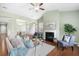 Cozy living room with a fireplace, hardwood floors, and comfortable seating, perfect for relaxing and entertaining at 106 Terrapin Cir, Summerville, SC 29483