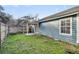 Backyard with grass, partial shade, and a covered outdoor seating area at 1060 Oakcrest Drive, Charleston, SC 29412
