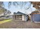 Fenced backyard featuring a screened porch, storage shed, and grass at 1060 Oakcrest Drive, Charleston, SC 29412