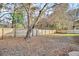 Expansive backyard with mature tree, wooden fence, and ample space at 1060 Oakcrest Drive, Charleston, SC 29412