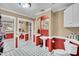 Stylish bathroom featuring pedestal sink, two-tone walls, black and white tile flooring, and storage at 1060 Oakcrest Drive, Charleston, SC 29412