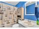 Charming blue bathroom featuring vanity with sink, updated lighting, and coastal-themed shower curtain at 1060 Oakcrest Drive, Charleston, SC 29412