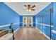 Bright bonus room with natural light, wood-look tile, and a ceiling fan at 1060 Oakcrest Drive, Charleston, SC 29412