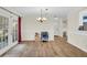 Spacious dining area featuring tiled floors, a chandelier, and french doors leading to the outside at 1060 Oakcrest Drive, Charleston, SC 29412