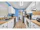 Practical kitchen featuring ample counter space, white cabinets, and stainless steel appliances at 1060 Oakcrest Drive, Charleston, SC 29412