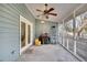 Spacious screened porch with ceiling fan, perfect for outdoor relaxation at 1060 Oakcrest Drive, Charleston, SC 29412