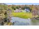 Scenic waterfront property with lush greenery, a private boat launch, and a tranquil boat at 1106 Mccrae Dr, Moncks Corner, SC 29461