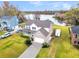 Attractive home featuring well-maintained landscaping, and a long driveway near a tranquil lake at 1106 Mccrae Dr, Moncks Corner, SC 29461