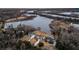 Beautiful aerial view of three homes next to a lake, offering stunning waterfront living at 1106 Mccrae Dr, Moncks Corner, SC 29461