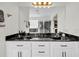 Bathroom featuring a dual sink vanity and black marble countertop at 1106 Mccrae Dr, Moncks Corner, SC 29461