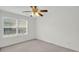 Bright bedroom with a large window and modern ceiling fan fixture at 1106 Mccrae Dr, Moncks Corner, SC 29461