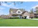 Charming two-story brick home with a covered front porch and well-manicured lawn at 1106 Mccrae Dr, Moncks Corner, SC 29461
