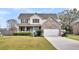 Charming two-story home with brick facade, large front lawn, and welcoming front porch at 1106 Mccrae Dr, Moncks Corner, SC 29461