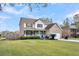 Charming two-story brick home with a well-manicured lawn and an inviting front porch at 1106 Mccrae Dr, Moncks Corner, SC 29461
