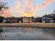Waterfront home with spacious lawn and gorgeous sky, providing an ideal setting for relaxation and outdoor activities at 1106 Mccrae Dr, Moncks Corner, SC 29461