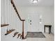 Welcoming foyer featuring tile flooring, elegant staircase and natural light from sidelight windows at 1106 Mccrae Dr, Moncks Corner, SC 29461