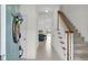 Bright foyer with tiled floor, staircase, and open view to kitchen creates an inviting entrance at 1106 Mccrae Dr, Moncks Corner, SC 29461