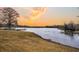 Scenic lake view with a fishing dock and beautiful sunset at 1106 Mccrae Dr, Moncks Corner, SC 29461