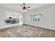 Open-concept living room showcasing a bright kitchen and a large window with natural light at 1106 Mccrae Dr, Moncks Corner, SC 29461