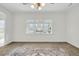 Bright living room featuring a decorative rug and a large window with natural light at 1106 Mccrae Dr, Moncks Corner, SC 29461