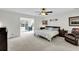 Spacious main bedroom featuring a ceiling fan and office area at 1106 Mccrae Dr, Moncks Corner, SC 29461