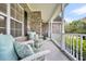 Inviting front porch with rocking chairs and decorative pillows, offering a comfortable and charming outdoor space at 1106 Mccrae Dr, Moncks Corner, SC 29461