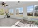 Bright sunroom featuring tile floors, large windows and tranquil views of the backyard and lake at 1106 Mccrae Dr, Moncks Corner, SC 29461