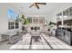 Bright sunroom with tile flooring, multiple windows, and comfortable seating area at 1106 Mccrae Dr, Moncks Corner, SC 29461