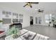 Bright sunroom featuring large windows, ceiling fans, and neutral tile flooring at 1106 Mccrae Dr, Moncks Corner, SC 29461