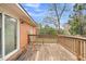 A view of the wooden back deck from the yard at 120 Carol Dr, Goose Creek, SC 29445