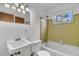 Bright, clean bathroom with a tiled shower and a window at 120 Carol Dr, Goose Creek, SC 29445