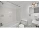 Well-lit bathroom featuring white tile and classic fixtures at 120 Carol Dr, Goose Creek, SC 29445