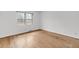 Bright bedroom featuring hardwood floors and a large window at 120 Carol Dr, Goose Creek, SC 29445
