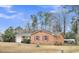 Brick single-story home with manicured landscaping, complemented by a cozy facade and inviting presence at 120 Carol Dr, Goose Creek, SC 29445