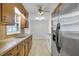 Traditional kitchen with wood cabinets, double basin sink, and stainless steel appliances, leading to dining area at 120 Carol Dr, Goose Creek, SC 29445