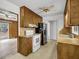 Kitchen features wood cabinets, modern appliances, and views to living spaces, creating a cozy atmosphere at 120 Carol Dr, Goose Creek, SC 29445