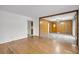 An open living space with hardwood floors and a partial wood-paneled wall at 120 Carol Dr, Goose Creek, SC 29445