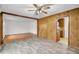 Spacious living room featuring wood paneling, tile flooring, and connection to the kitchen at 120 Carol Dr, Goose Creek, SC 29445