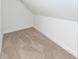 Unfinished attic space with hardwood floor and sloping walls at 123 White Picket Ln, Summerville, SC 29483