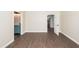 Bedroom featuring wood floors, doorway to en suite bathroom and another door to the hallway at 123 White Picket Ln, Summerville, SC 29483